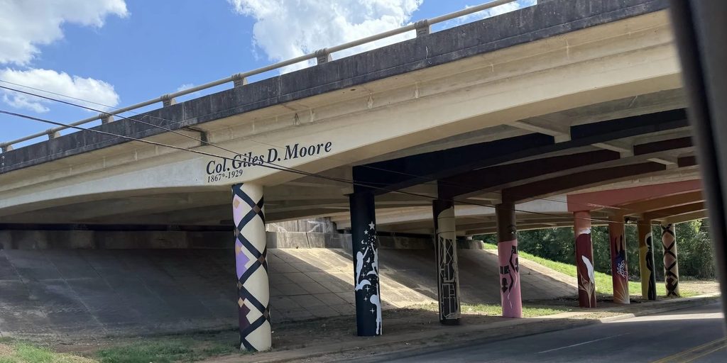 Painted columns under the Col. Giles D. Moore overpass, inscribed 1867 to 1929
